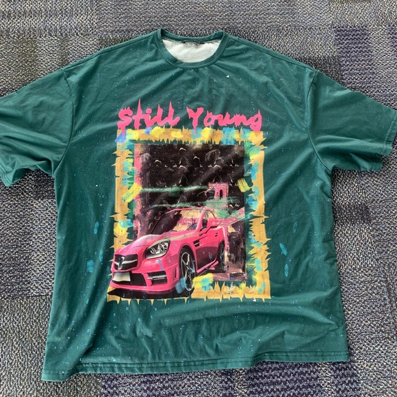 Tops - green “still young” graphic tee
